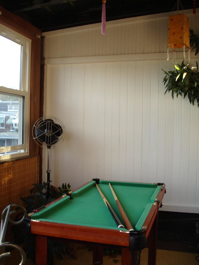 If you don't want the wicker recliner in the sunroom, we can always put the pool table in and you can practice!