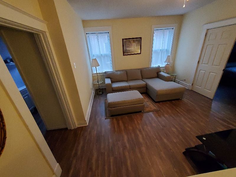 This is the upstairs living room with sectional couch and large TV