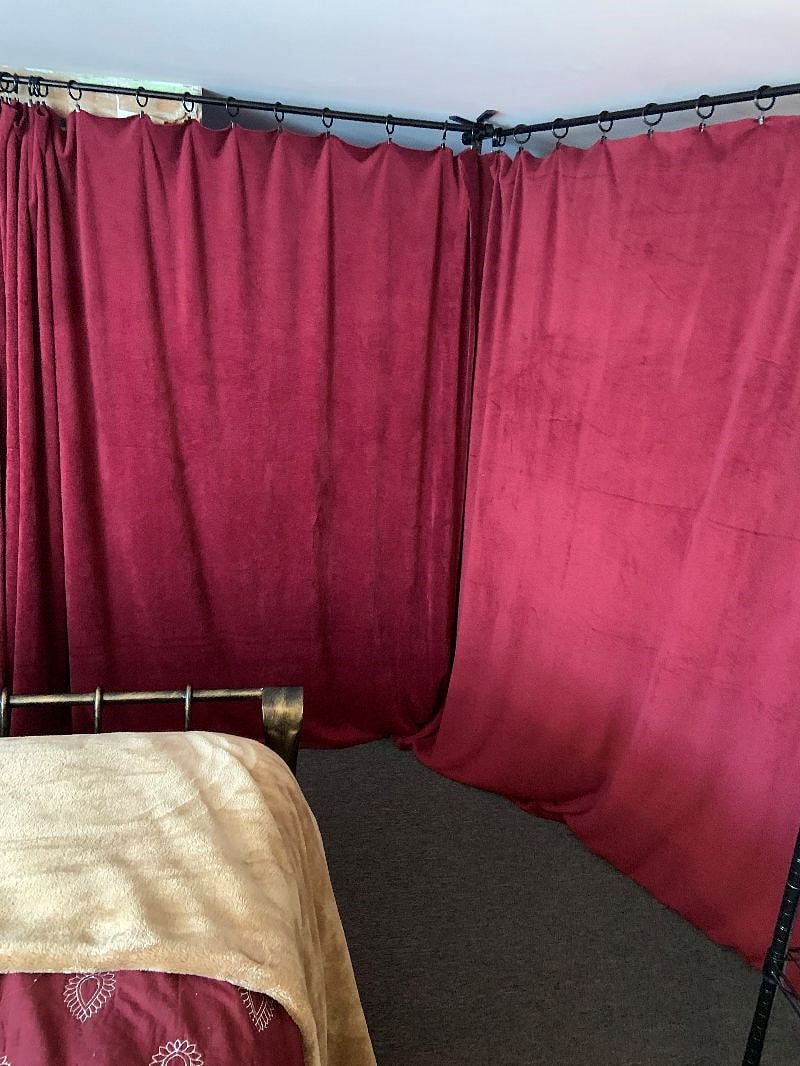 Inside bedroom with curtain wall closed.