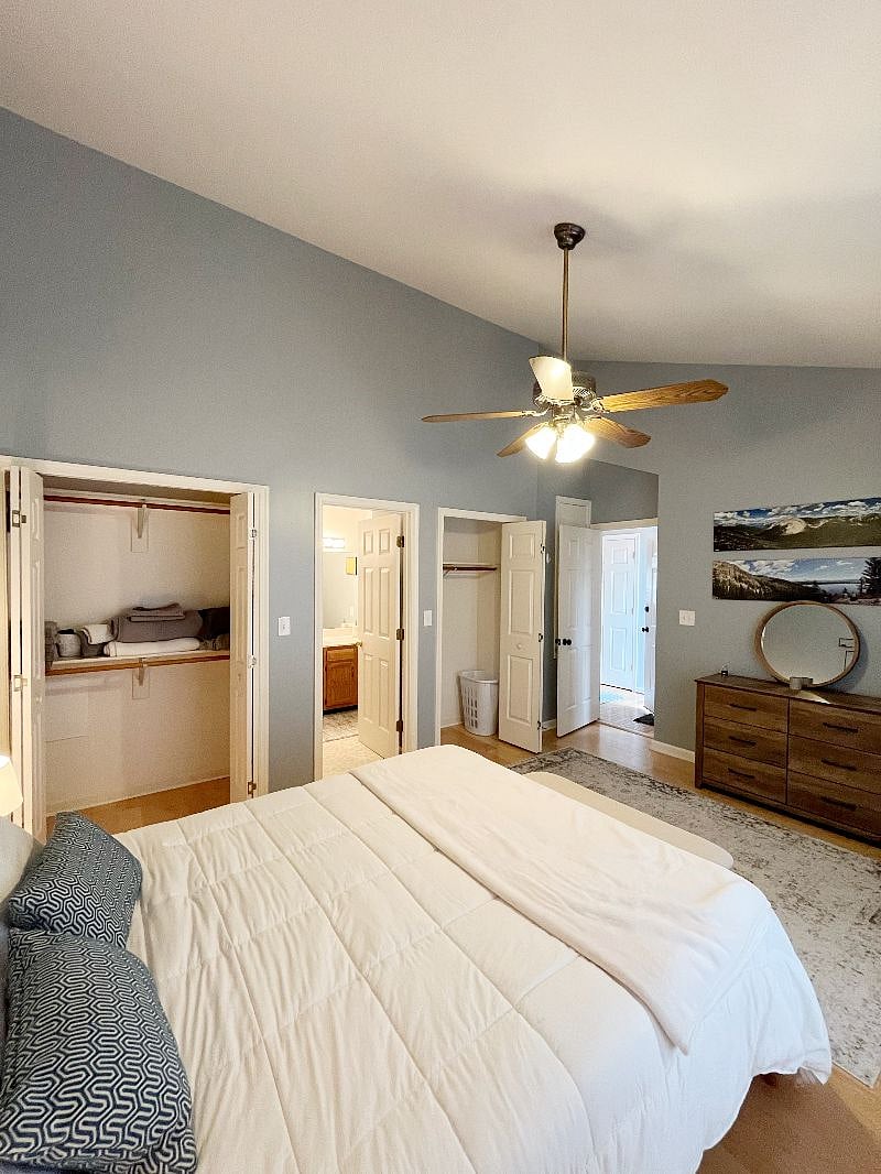 Bedroom with two closets, dresser and private full bathroom