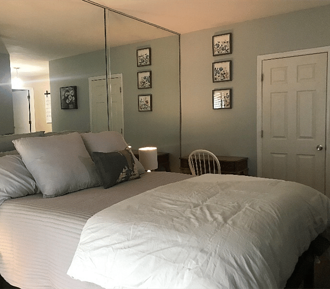View of bed with desk