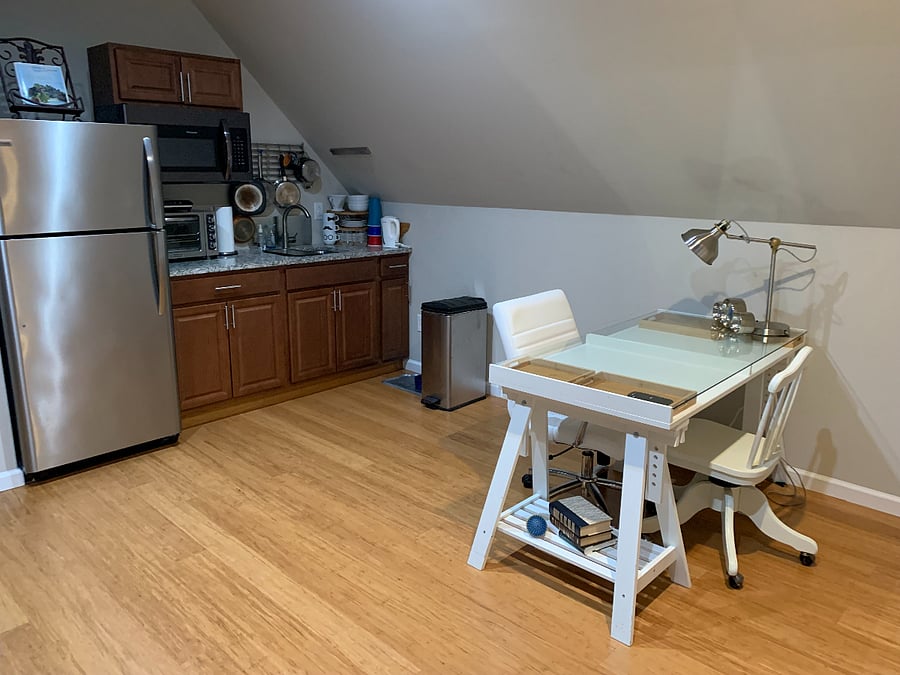full size refrigerator, microwave, induction cooktop and toaster oven.