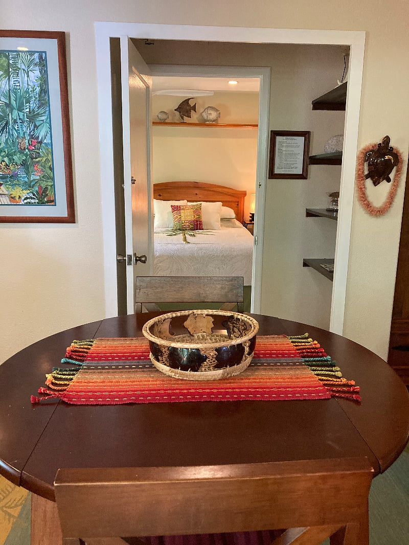 A view into the bedroom from sitting/kitchenette room. A door can be closed to separate the rooms.