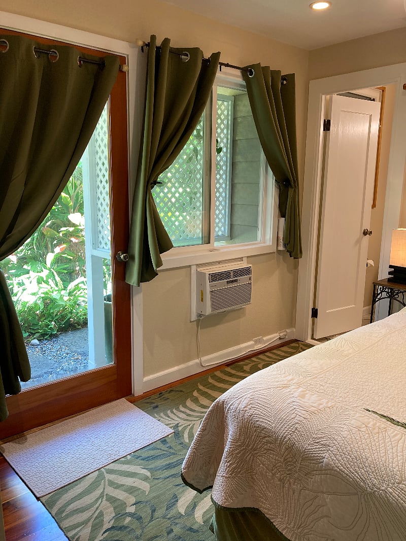 A view to the outside and into the bathroom from the bedroom.
