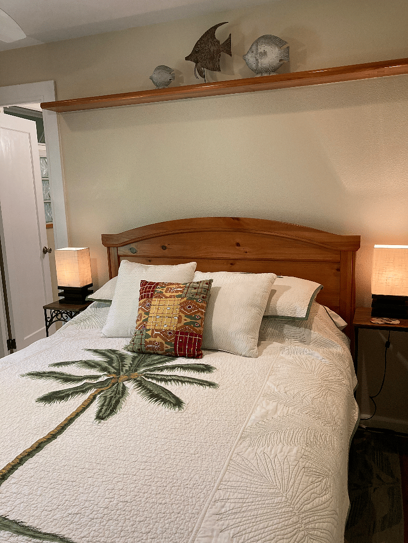A view of the bedroom and entrance into the bathroom.