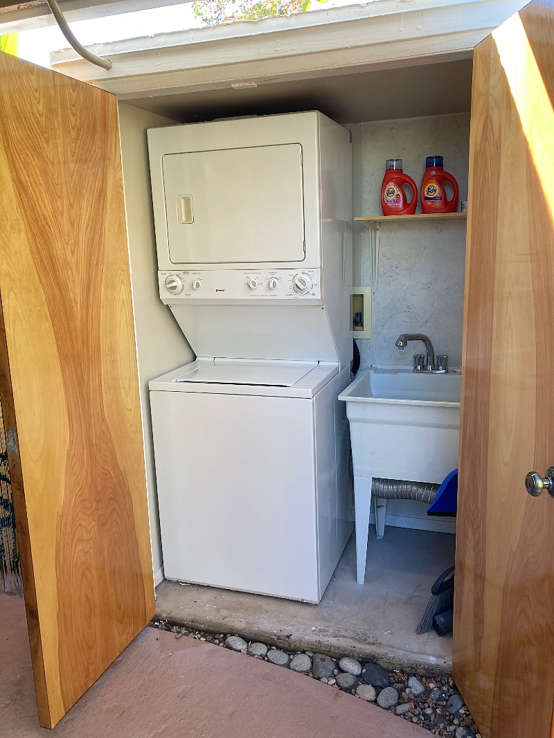 Private washer/dryer and utility sink.