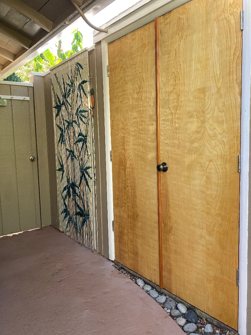 Private outdoor shower and utility room.