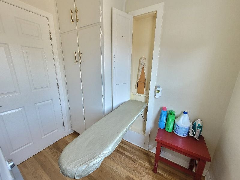 This cool, quirky and original piece of history, circa 1939, is a fully functional ironing table located in the W/D room.