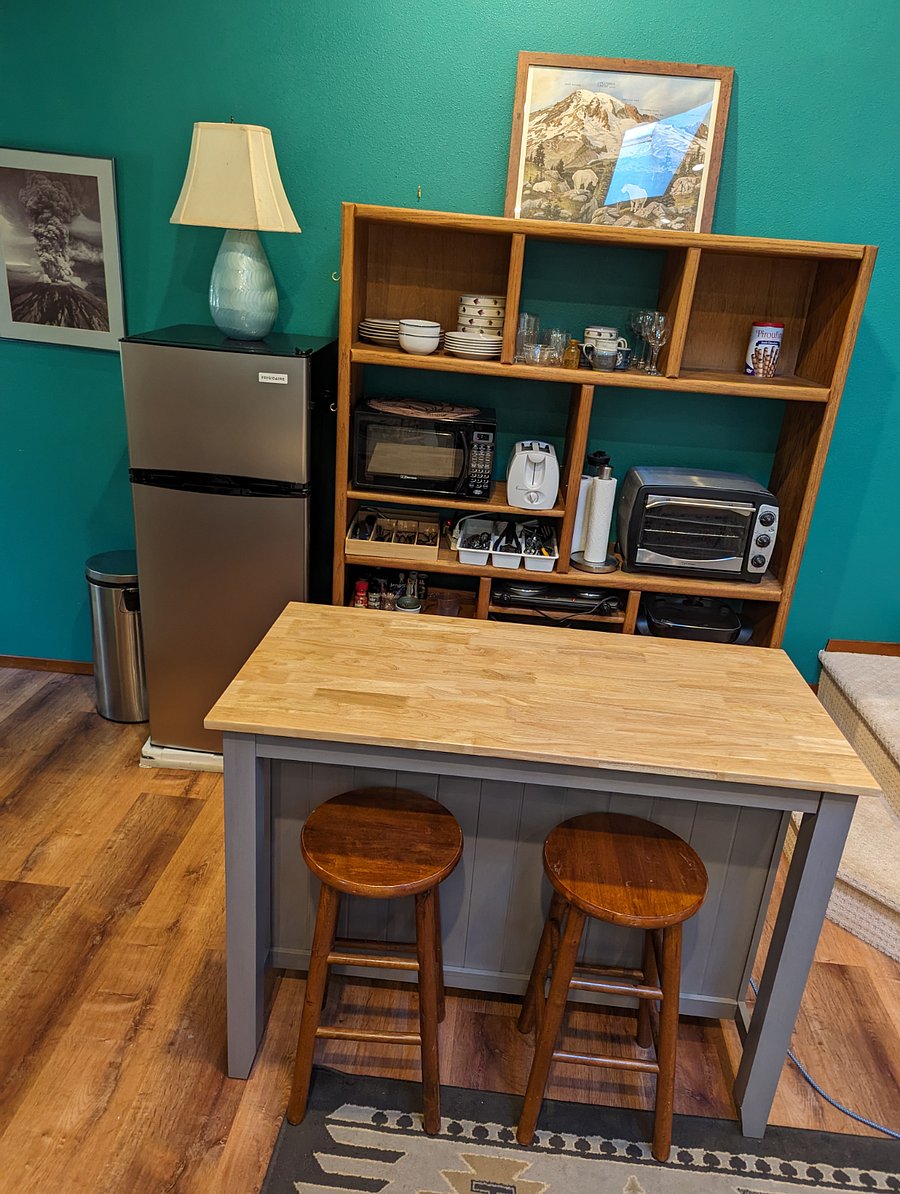 kitchen with everything but a big oven. has toaster oven, microwave, two burners, skillet. crockpot. toaster, coffee maker, and smoothie maker.