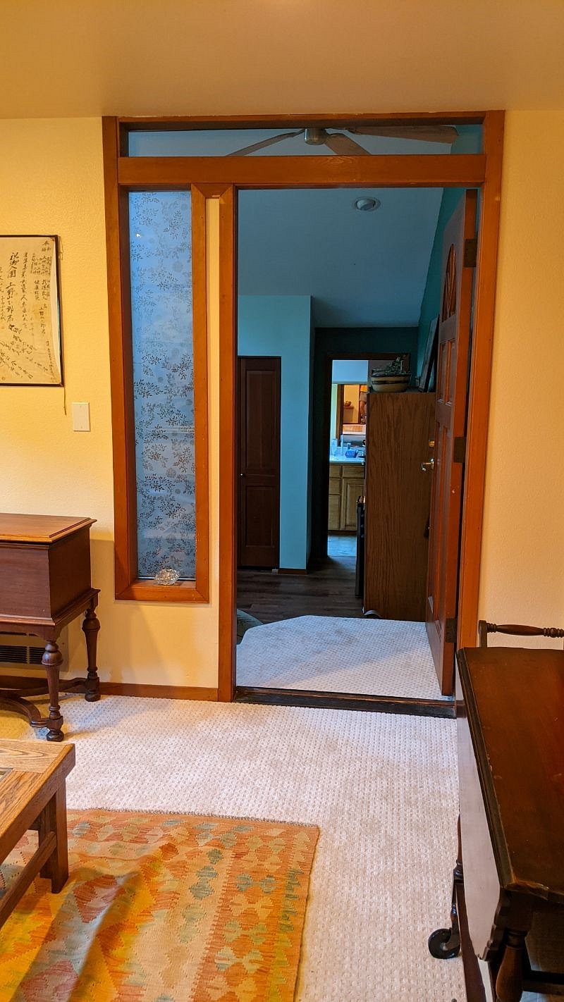 Long view, from bed room through big room into bathroom mirror,