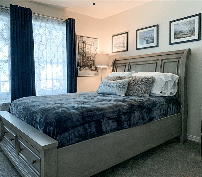 Beautiful queen bed purchased from Ashley furniture in the second bedroom.