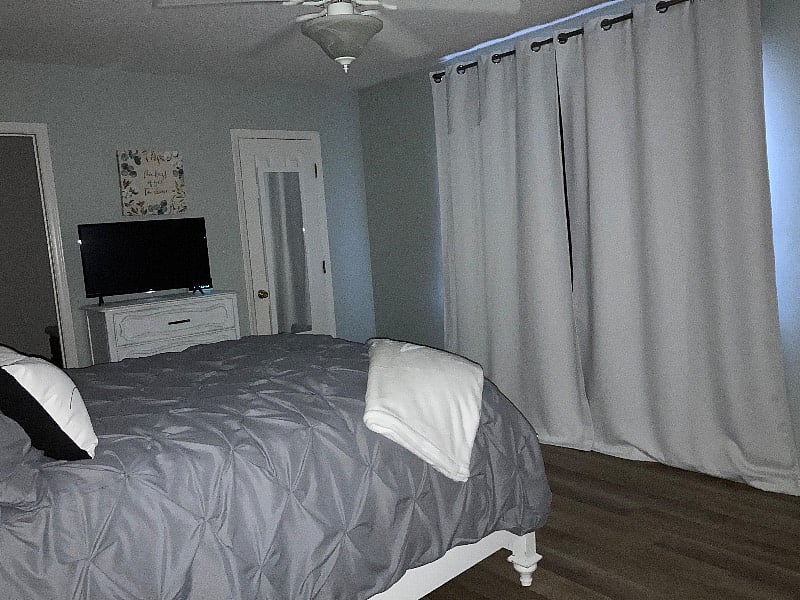 Master bedroom with blackout curtains closed....hard to capture but they are the best blackout curtains I have found for my night nurses. 