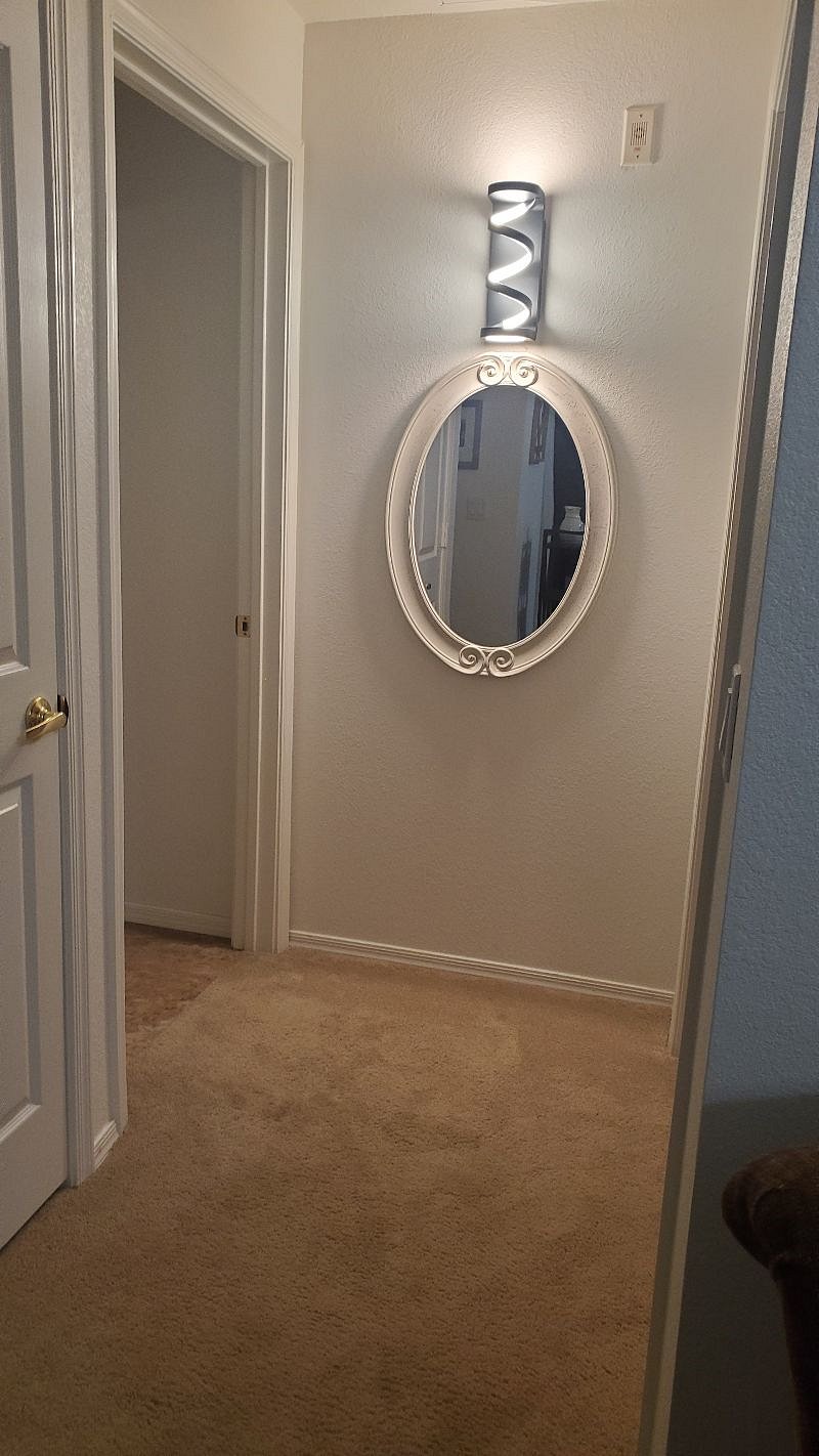 Hall with the master to the right and bathroom to the left