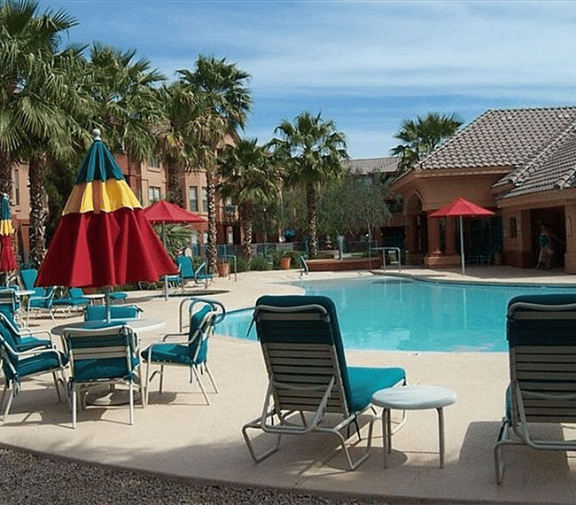 Saltwater pool with beach access and a hot tub.