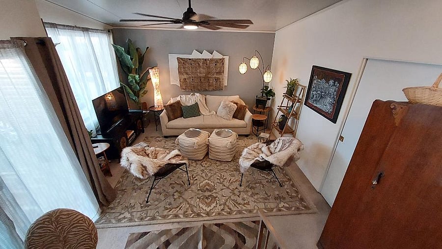 the chillazing room with big TV and desk for an office.