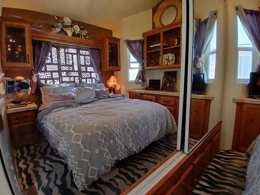 the queen bedroom with big   closets and luxury linens.