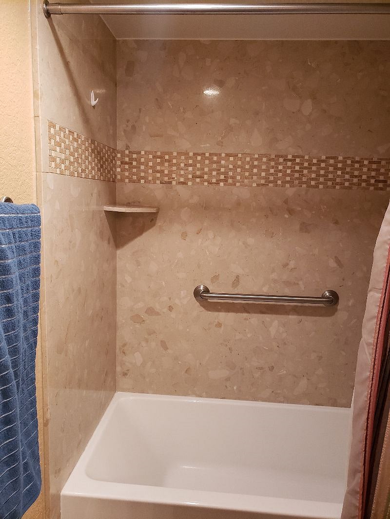 Shower with grab bar