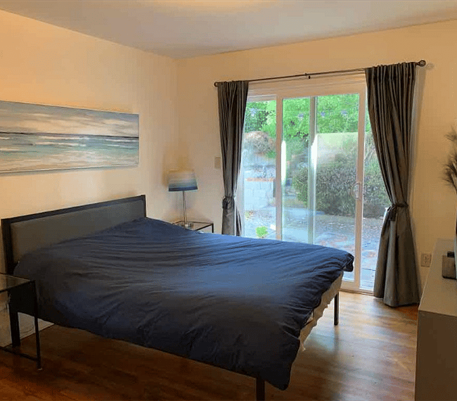 Master Bedroom with access to private tiered gated backyard