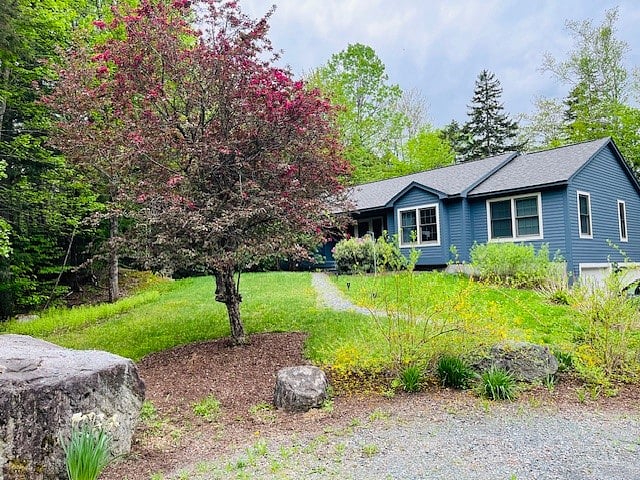 Front of house/driveway in spring.