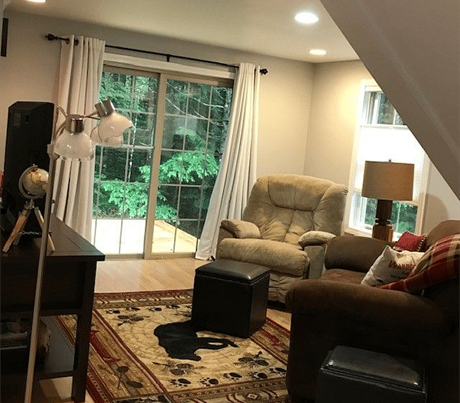 Living room area with sliding glass door to brand new 10X10 deck.