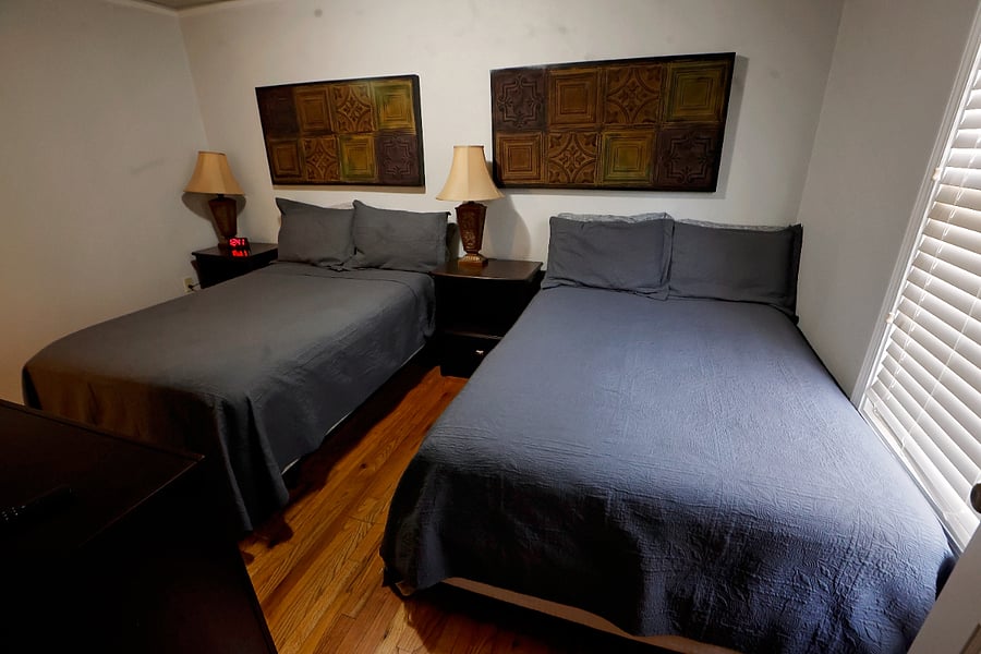 bedroom two with 2 double beds and plenty of closet space