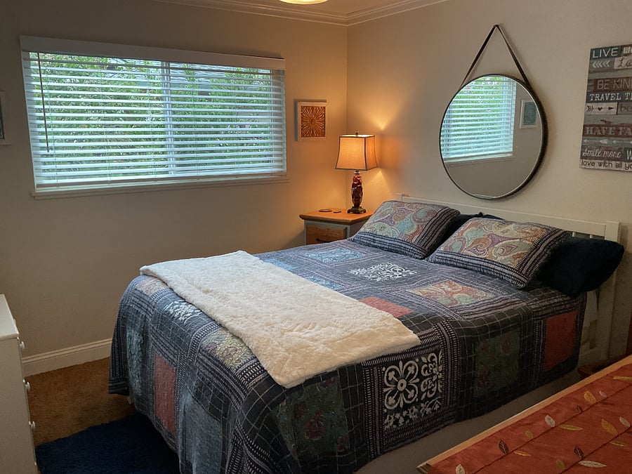 Queen size bed and nightstand.