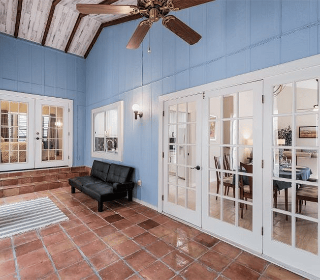Florida sitting room with french doors to second bedroom and dining room