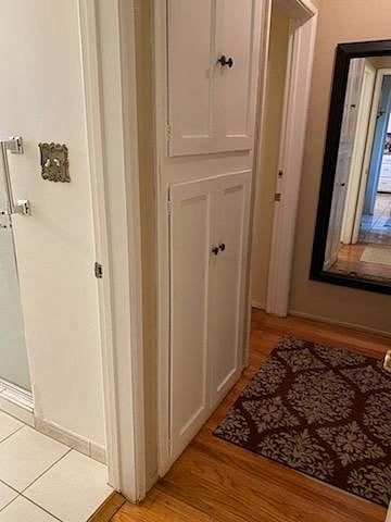 The first door from the hallway leads to the shared bathroom. The second door to the left is a bedroom that shares a bathroom with female guests. 