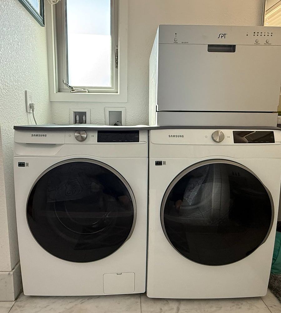 Separate washing machine and dryer, and dishwasher (on top) - now installed in the bathroom (opposite from shower) instead of the washer-dryer combo shown in other pictures