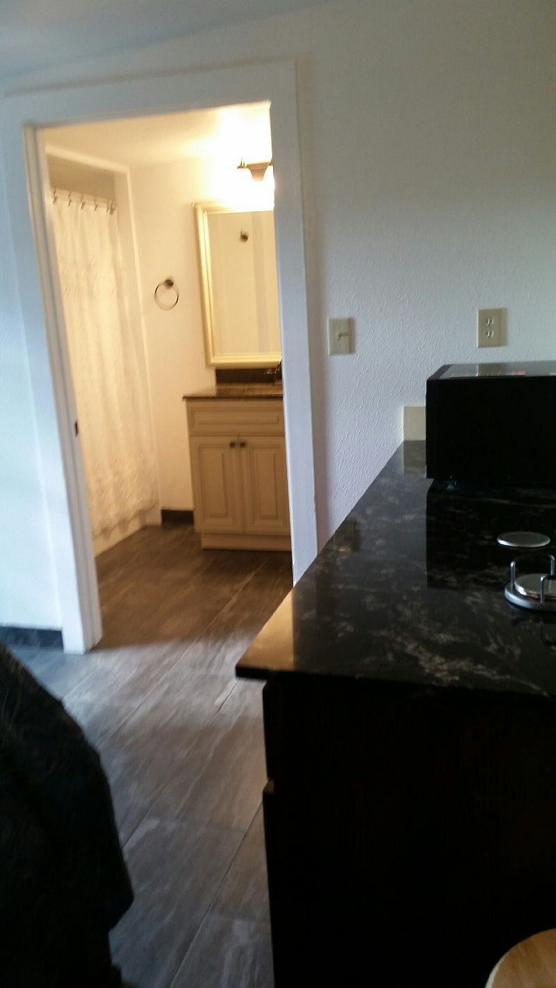 Newly renovated! New tile floors, granite tops, beautiful hand made beaded shower curtain!