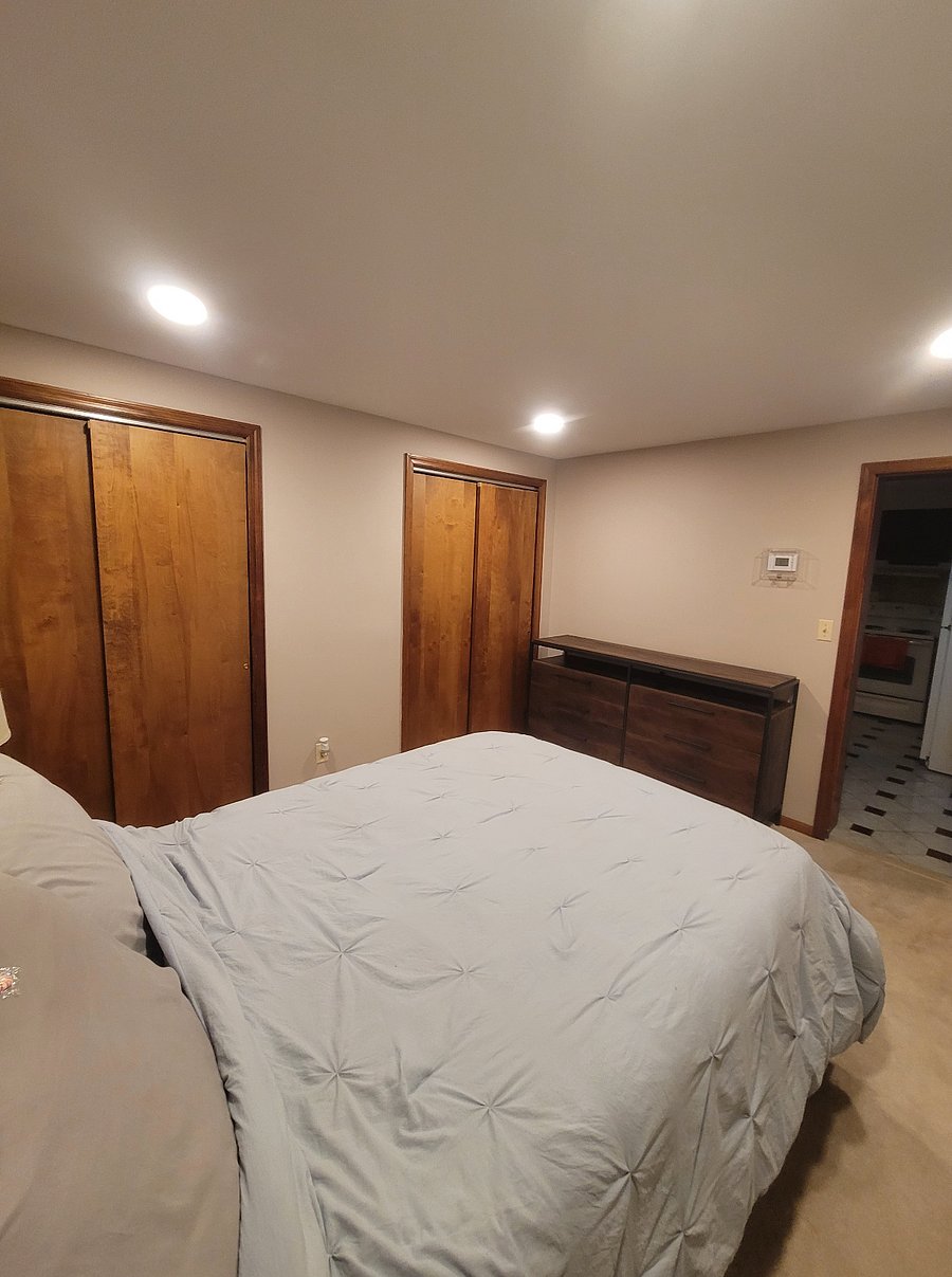 Bedroom with double closet and full size bed