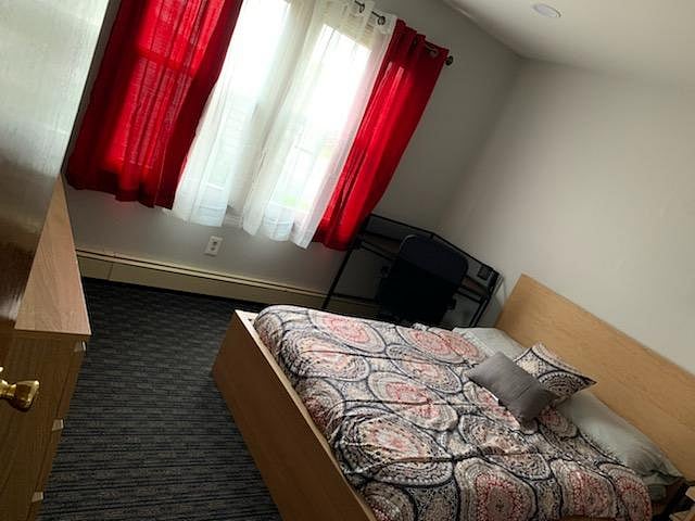Third bedroom with desk and 50 inch smart TV.