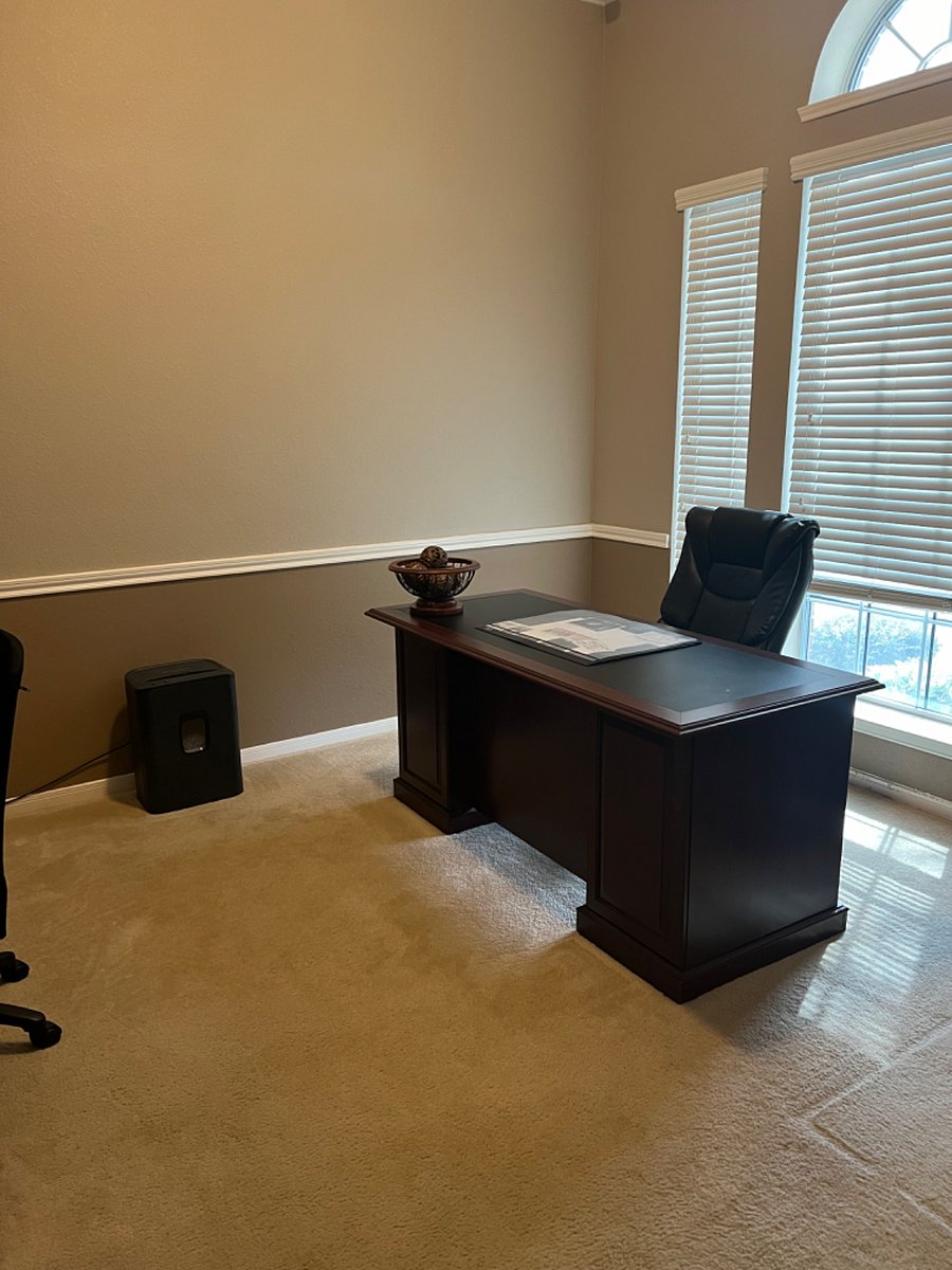 Office with large desk. 