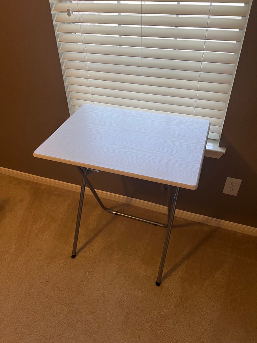Work table in the bedroom, can be moved around the property as needed. 