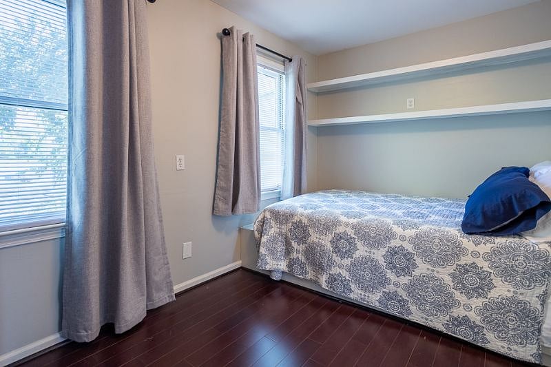 FULL size bed, black out curtains, TV and dresser.