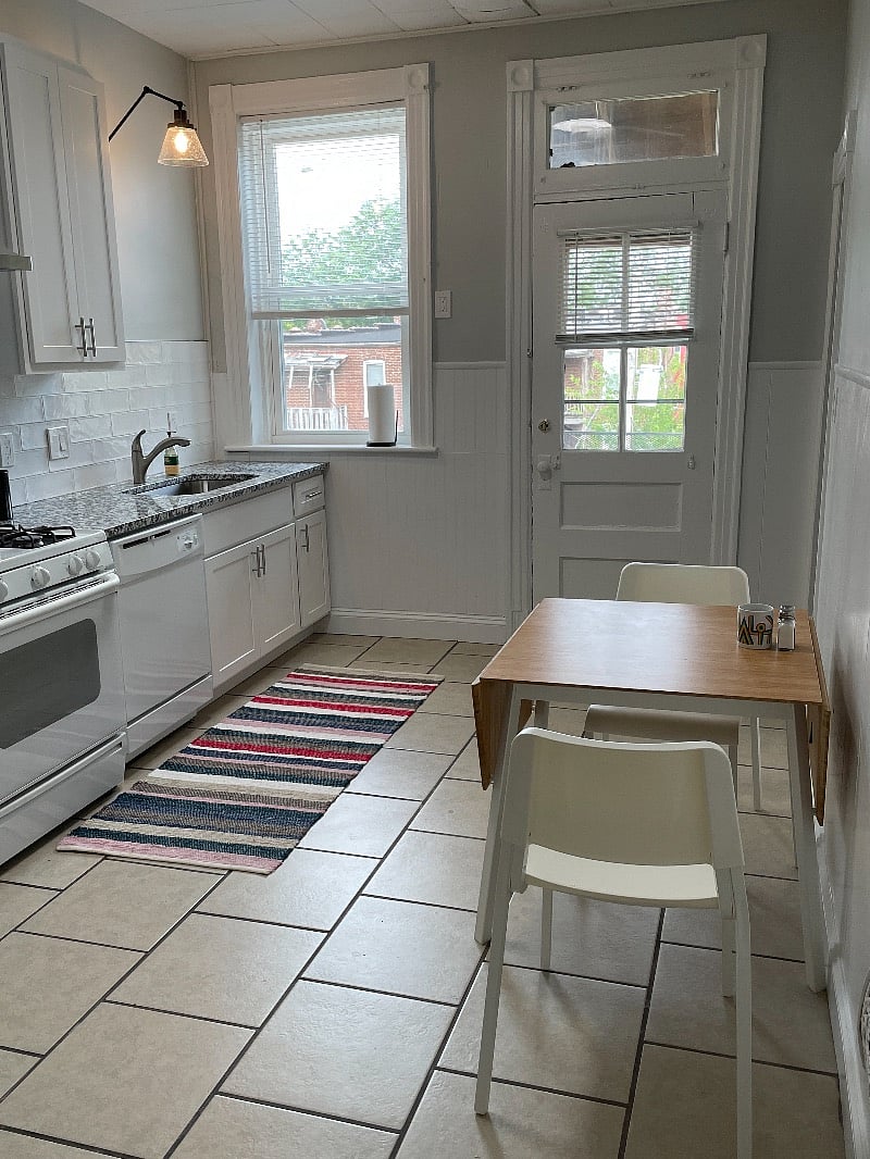 Eat-in kitchen with granite countertop, new cabinets, and dishwasher.