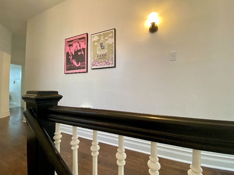 As you come up the stairs, the apartment hall takes you to all of the rooms - one bedroom and office toward the front, living room in the middle, kitchen, bathroom and second bedroom in the back.