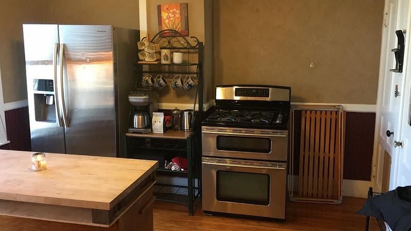 Nice kitchen with stainless steel appliances and convection over. 