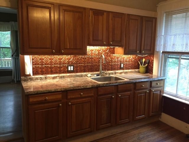 Kitchen, with maple cabinets, has USB ports to charge while you cook!