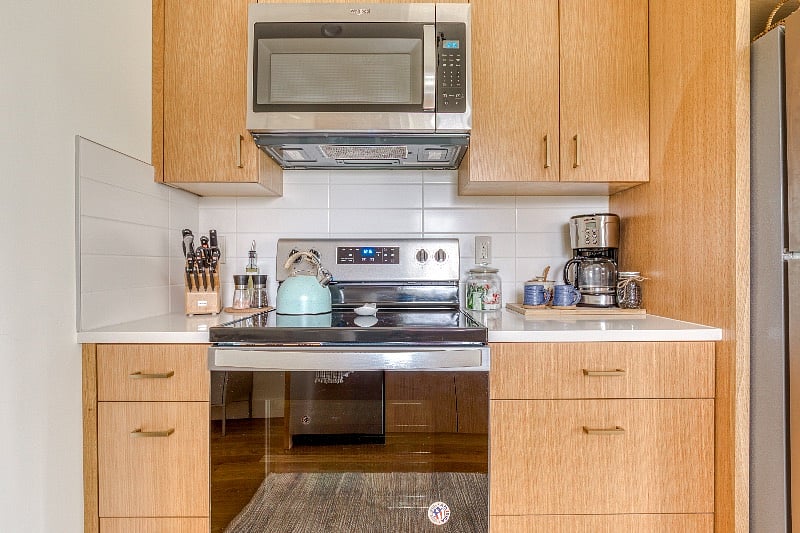 Kitchen, Microwave, electric stove top, oven, full refrigerator.