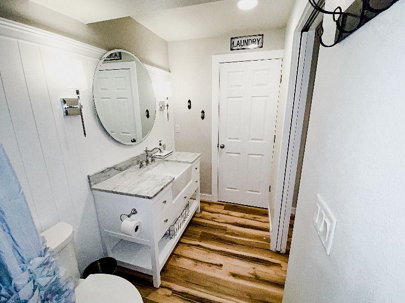 Large vanity with farmhouse sink and lots of storage
