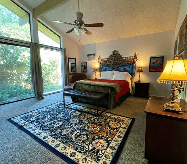 Light-filled bedroom with a private door to the patio.