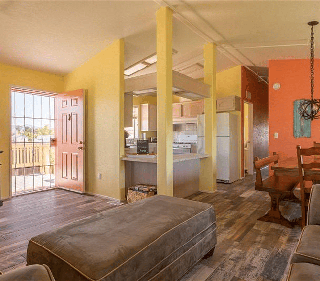 open living room dining area wraps around the airy country kitchen. 