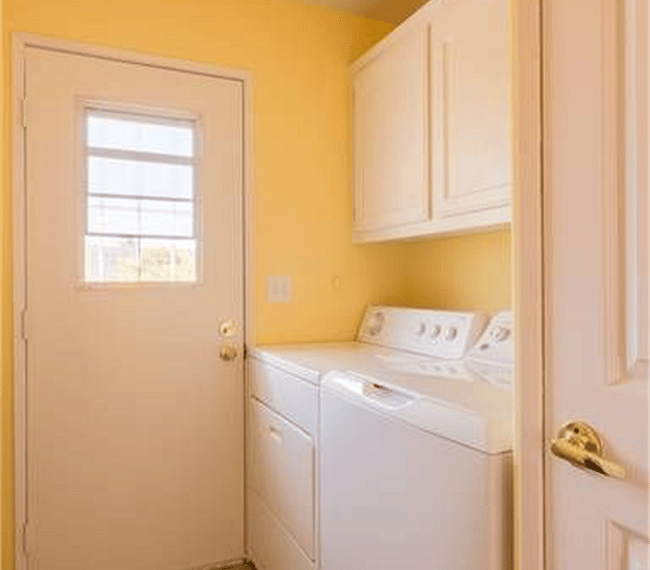 laundry room with back door to porch overlooking the orchard. 