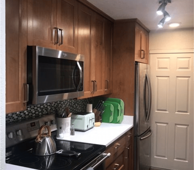 Kitchen with quartz countertops and stainless appliances