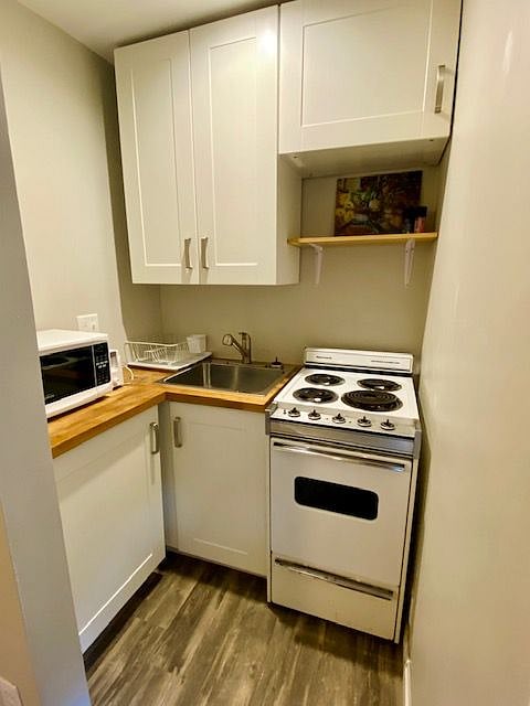 Kitchenette with all you need. Full size refrigerator is in the living space.