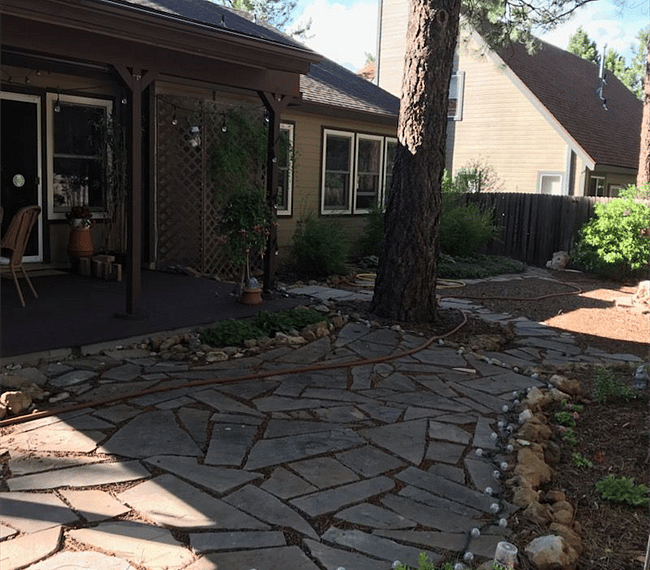 covered back patio & "garden" area with water feature