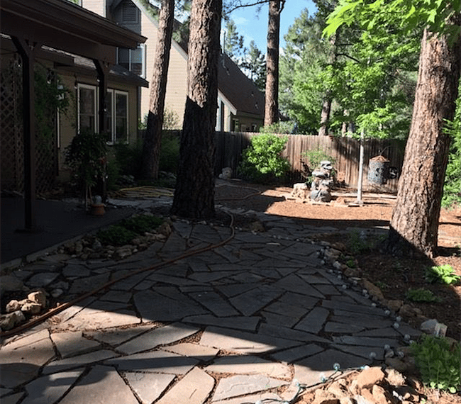 covered back patio & "garden" area with water feature