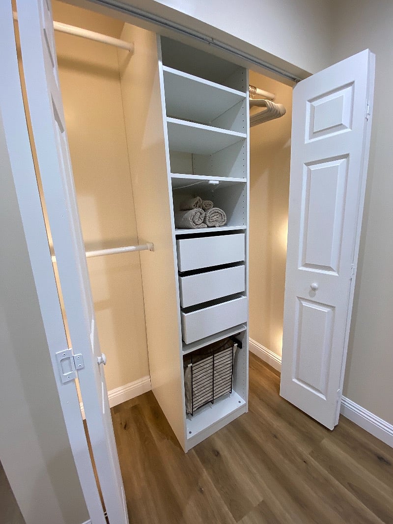 Closet with lots of storage with lighting
