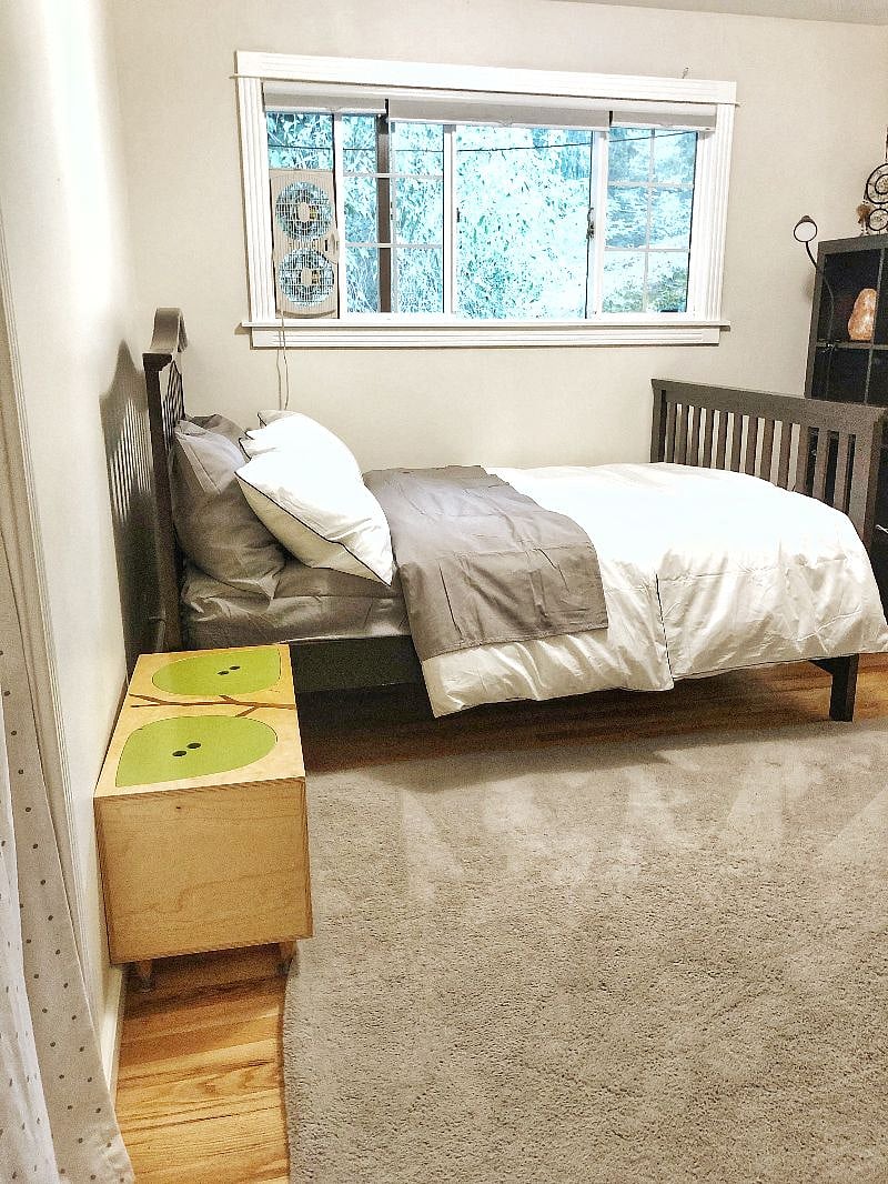 private bedroom with shelf, dresser, and small closet